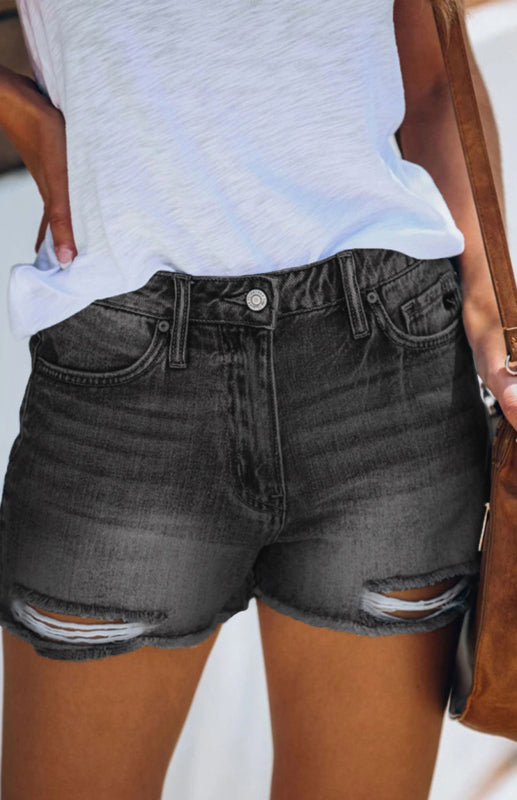 a close up of a person wearing shorts and a white shirt