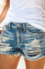 a woman wearing shorts with holes on the side