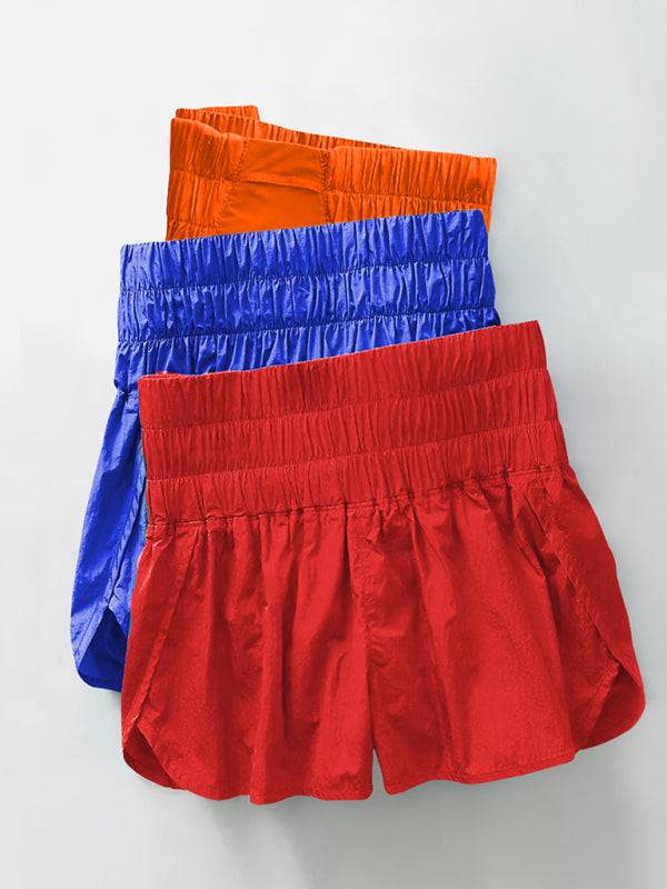 three pairs of red, blue, and orange boxers