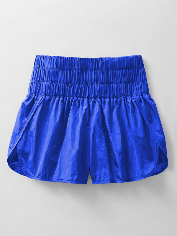a pair of blue shorts hanging on a wall