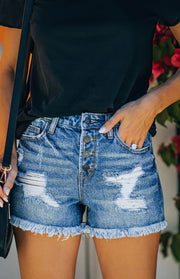 a close up of a person wearing shorts and a black shirt