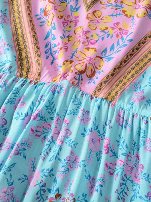 a pink and blue dress with flowers on it