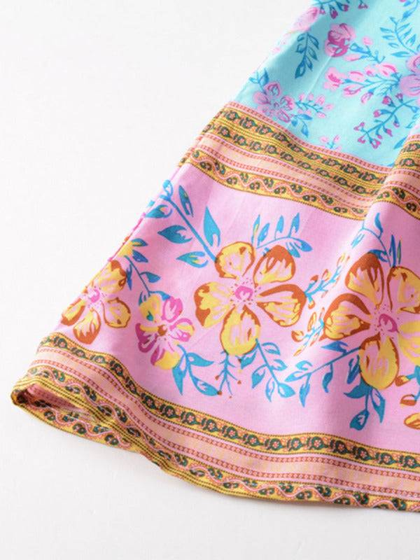 a close up of a pink and blue flowered cloth