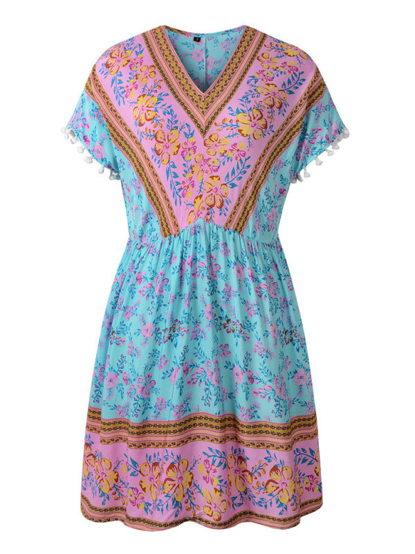 a blue and pink dress with flowers on it