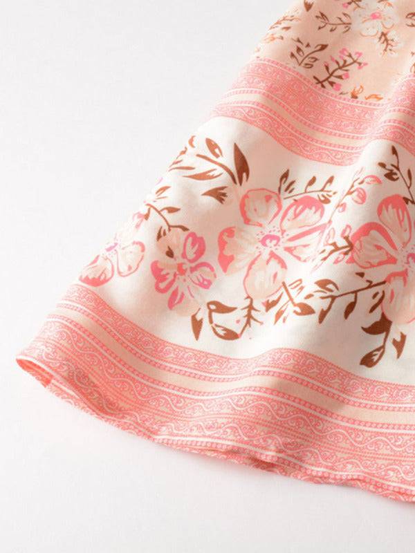a close up of a pink and brown flowered cloth