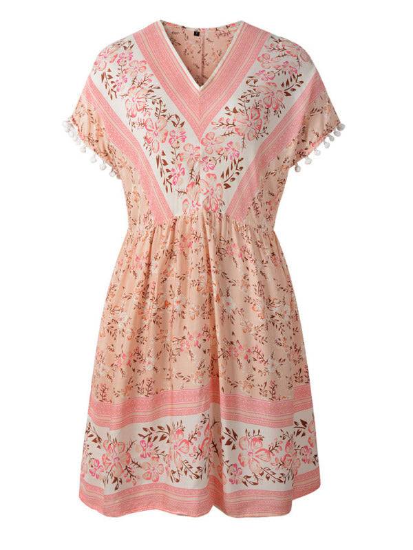 a women's dress with pink and white flowers