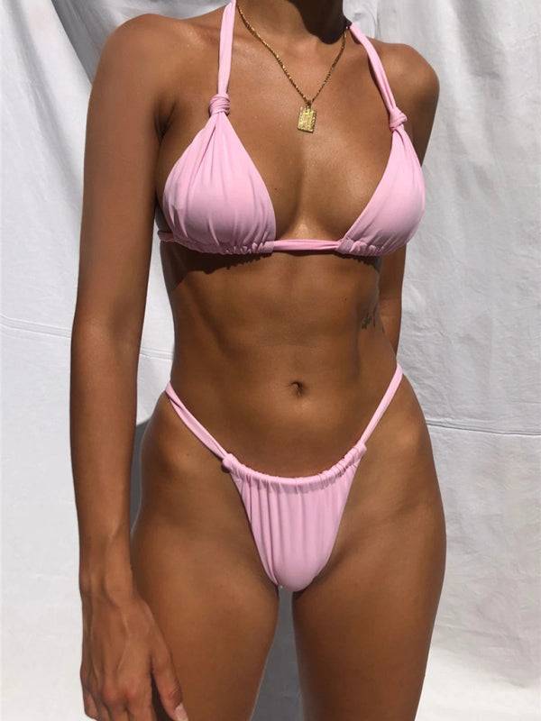 a woman in a pink bikini posing for a picture