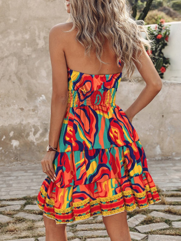 a woman in a colorful dress standing on a cobblestone street