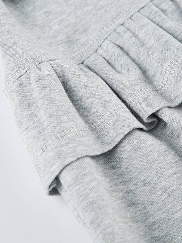 a close up of a person's pants with ruffles