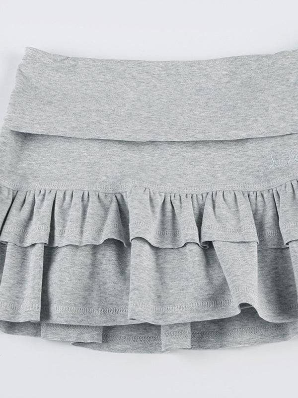 a grey skirt with ruffles on the bottom