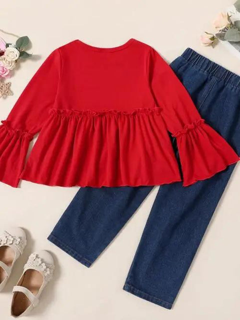 a toddler's outfit with a red top and jeans
