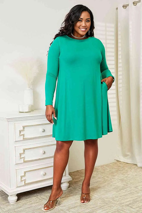 Zenana Full Size Long Sleeve Flare Dress with PocketsElevate your wardrobe with this dress, a perfect balance of style and convenience. The long sleeves provide a touch of elegance and warmth, making it suitable for vaDRESS