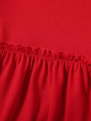 a close up of a red dress with ruffles