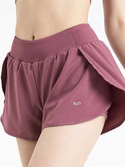 a close up of a woman's shorts with ruffles