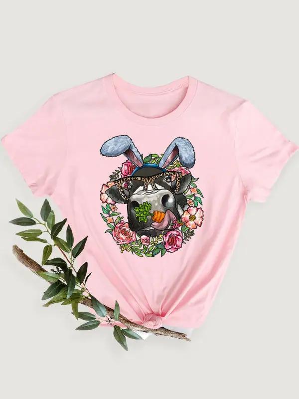 a pink t - shirt with an image of a rabbit wearing a hat