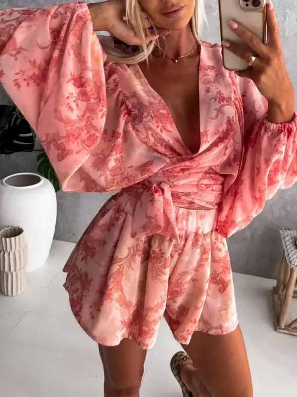 a woman taking a selfie in a pink dress
