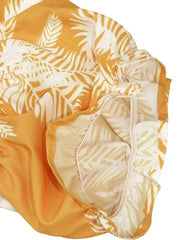 a yellow and white blanket with a white and yellow design