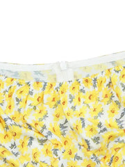 a close up of a yellow flowered boxer shorts