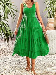 a woman wearing a green dress and sandals