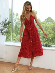 a woman wearing a red polka dot dress