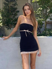 a woman in a short dress posing for a picture