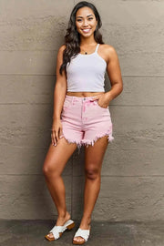 RISEN Kylie High Waist Raw Hem ShortsThese shorts feature a flattering high-rise waist that accentuates your curves while providing a secure fit. The side step hem adds a trendy twist, giving a unique tDenim Shorts